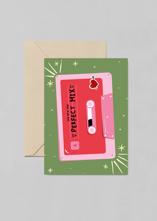 A cute post card with words “We’re The Perfect Mix” showing an illustration of a music cassette. This greeting card is the perfect pick to let a loved one know you love him/her.