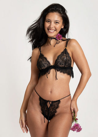 Smiling woman looking confident and elegant in black Lioa Lingerie set.
