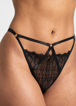 details of the thong with golden ring details and straps
