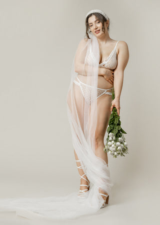 curvy bride is ready for the wedding in the perfect white bridal lingerie from lioa lingerie