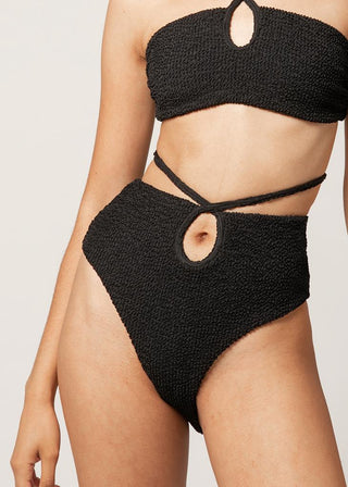 woman wears high-waist bikini bottoms with textured fabric by lioa lingerie