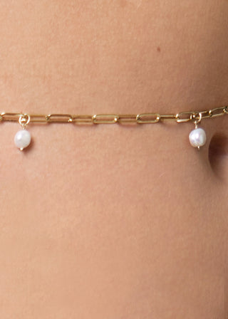 Detail of golden body chain with pearl details from Lioa Lingerie