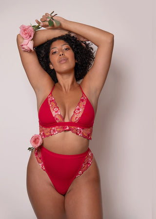 curvy woman wears red underwear set with floral embroidery