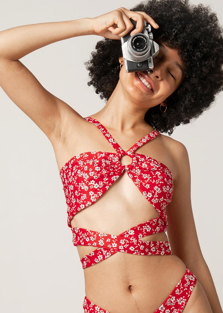 woman wears red wrap bikini top by lioa lingerie