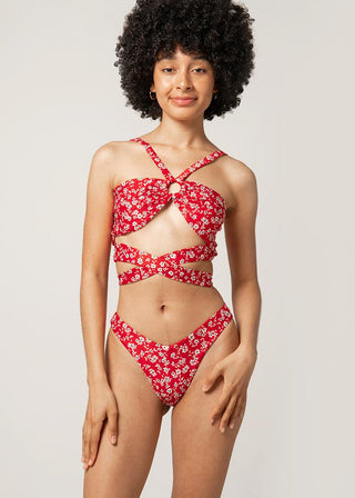 woman wears red floral bikini top by lioa lingerie