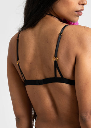 details of the black bralette with gold details