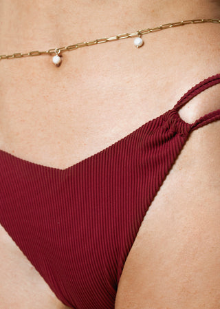 detail of burgundy bikini bottom in rib fabric