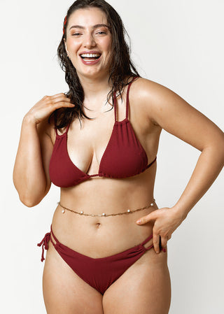 curvy woman wears burgundy bikini with rib fabric