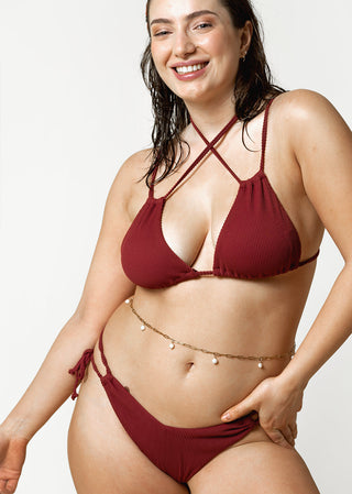 happy curvy woman wears burgundy bikini by lioa lingerie